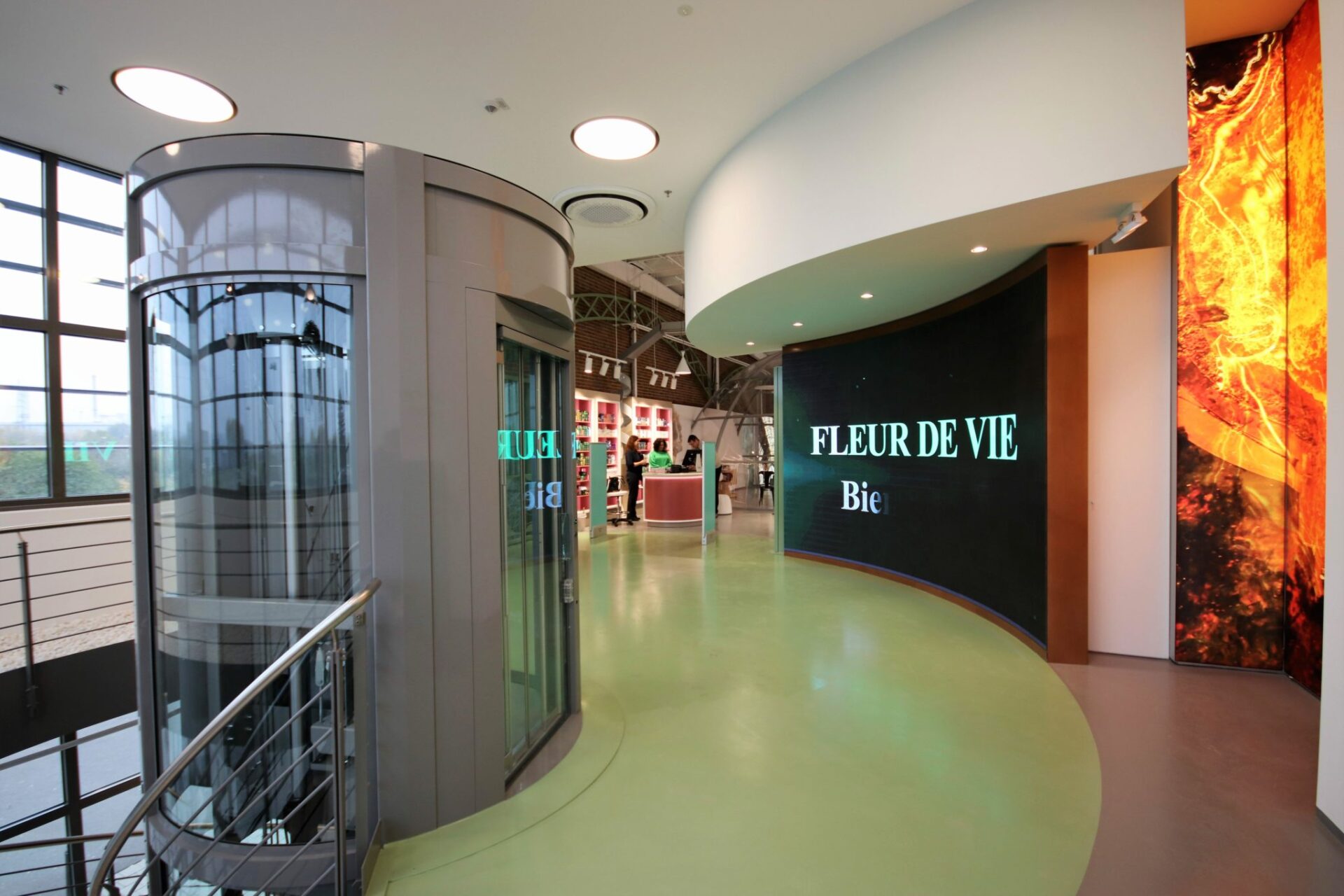 runder-aufzug-giotto a living room with a large couch and glass doors