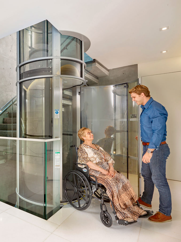 vakuum-lift-lilienthal a building with glass walls and a rock